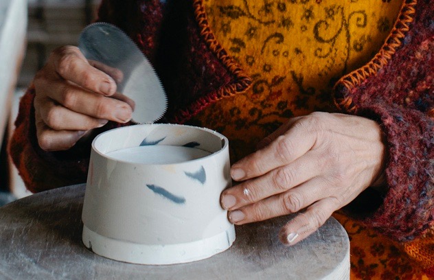 Clay-covered hands, photo Luisa Brimble